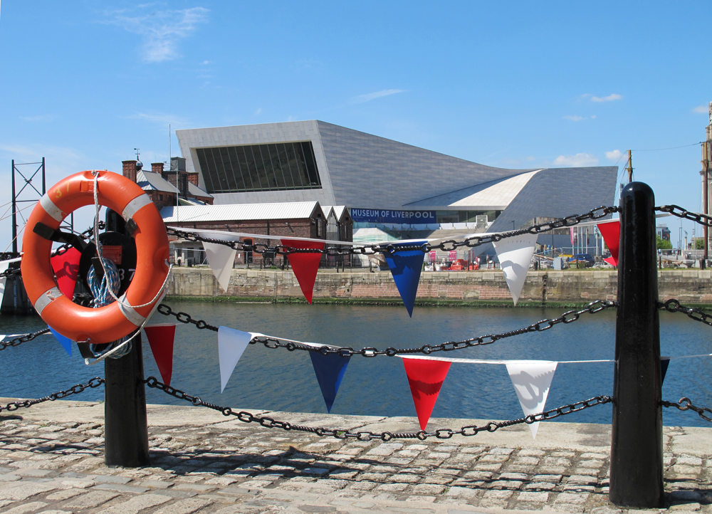 museum of liverpool viewed from behind a bollard with bunting and a lifering hung on the railing as location for my story