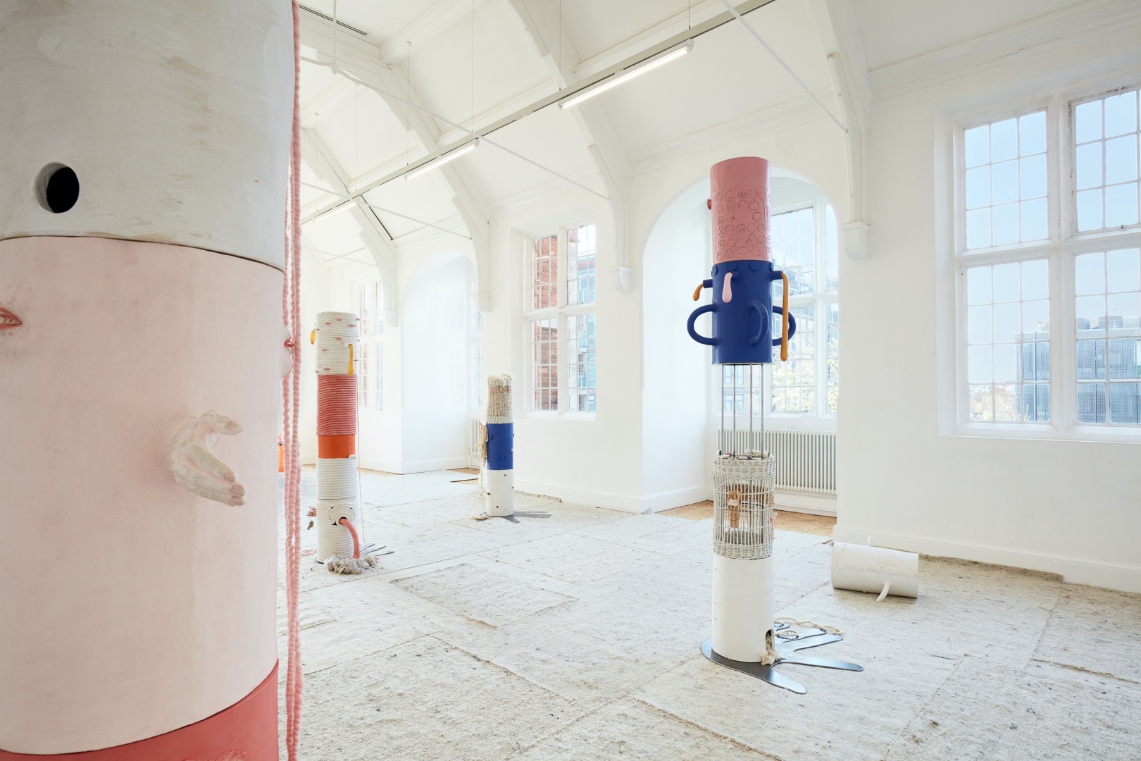 Art installation by Jonathan Baldock - a white room with brightly coloured art pieces