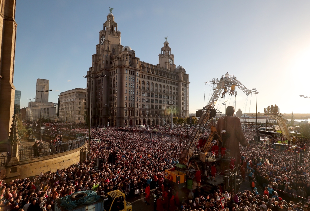 Giant on the strand in front of the royal liver building surrounded by crowds as far as is space