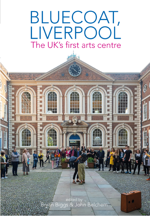 bluecoat front of the building with people in the courtyard during the day time