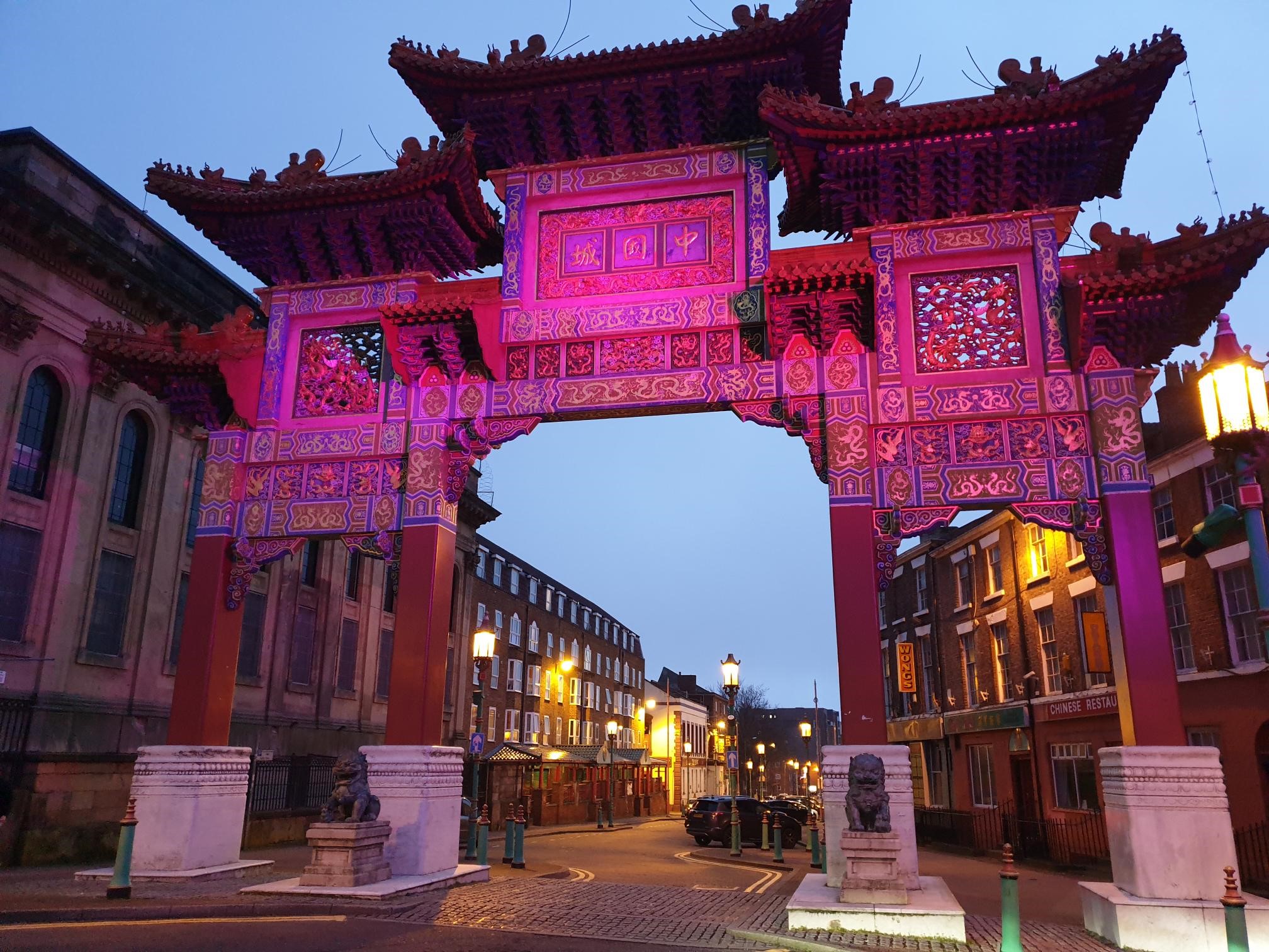chinese arch in liverpool lit up in purple