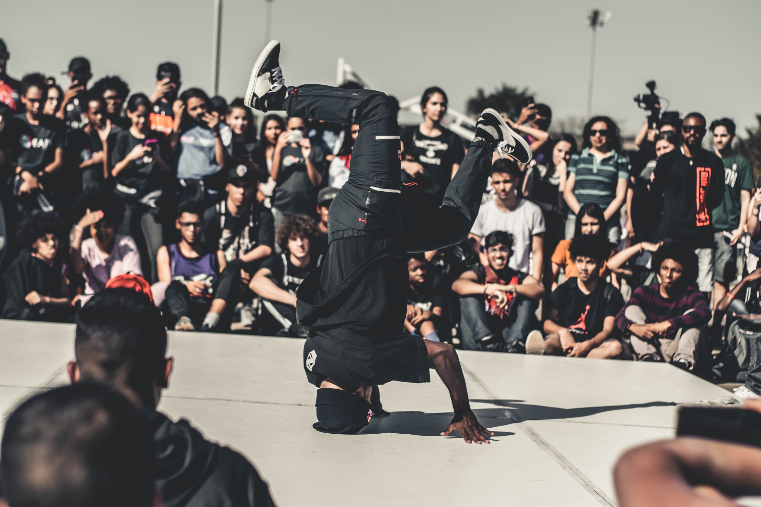 hip hop artists break dancing in front of a crowd