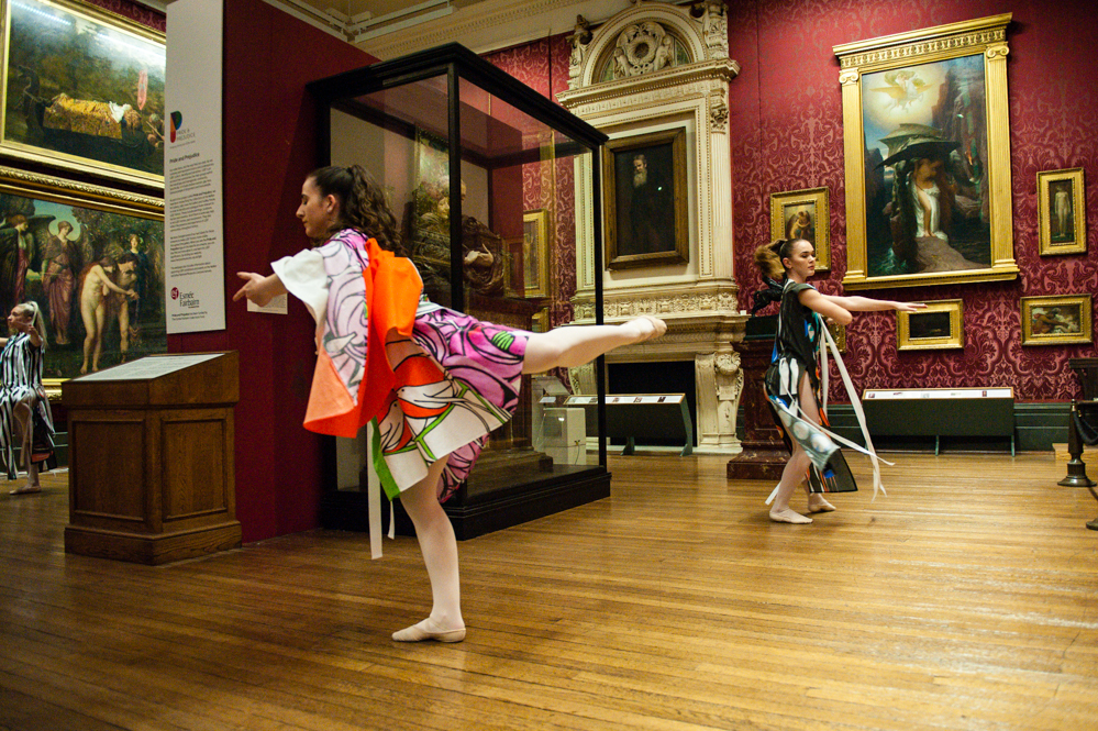 children dancing in a gallery