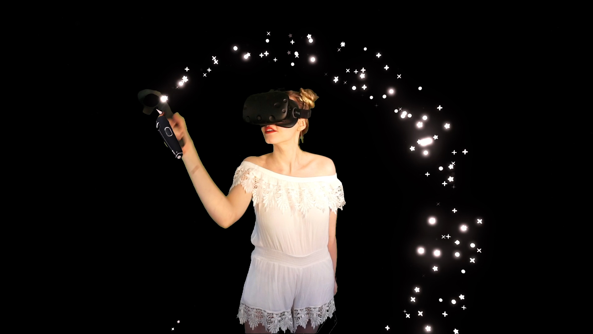 lady in white outfit with a black mask creating stars in an arch around her head with her finger