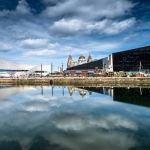 liverpool waterfront from the dock looking at the museum of liverpool and liver birds