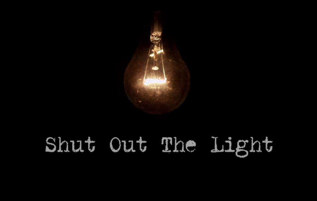 picture of a glowing bulb on a black background with writing that says shut out the light
