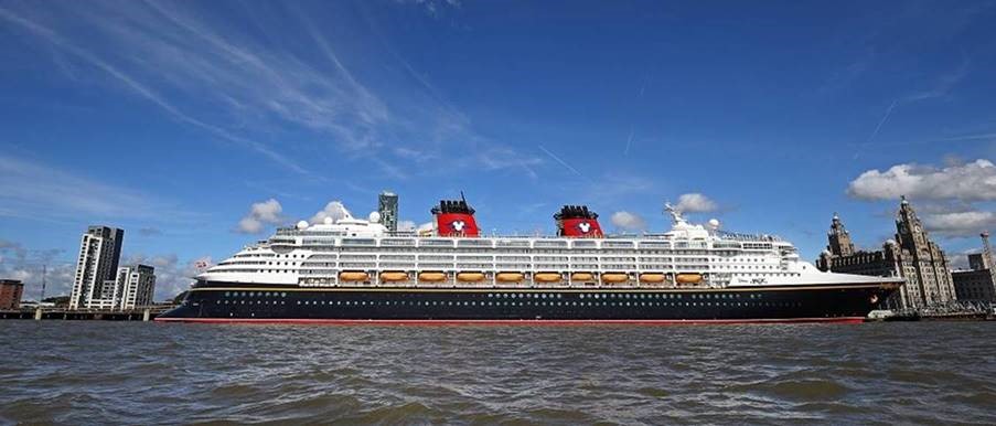 disney cruise vessel in front of the liverpool waterfront at cruise liverpool
