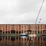 Tate Liverpool viewed from opposite side of alvert dock against a grey sky