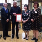 denise jones stood alongside femlae colleague, two male colleagues including the deputy lord mayor receiving award in library