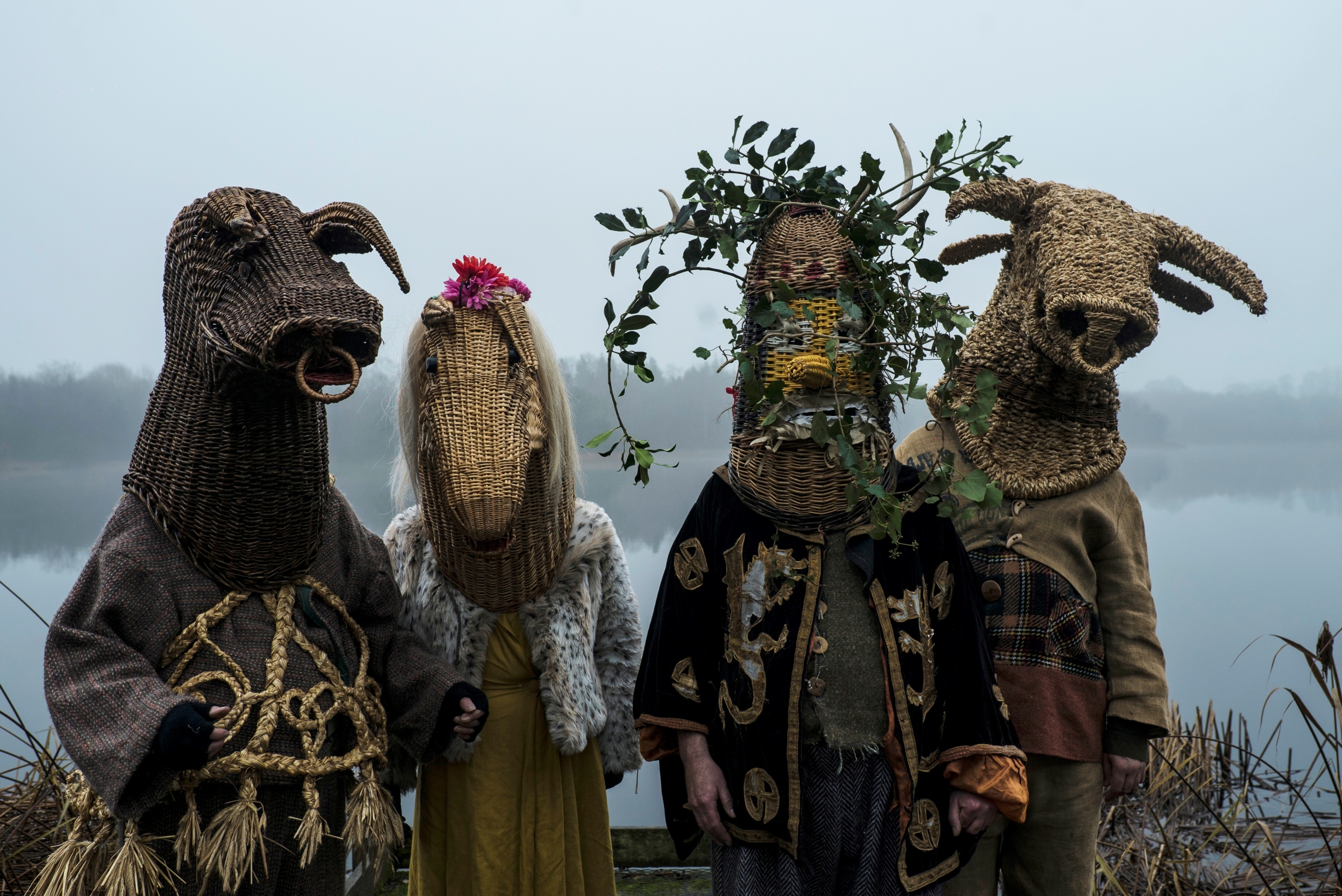 fourcharacters dressed in costume with their faces invisible