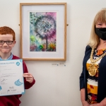 dot-art schools little boy holding certifcate in front of artwork with lord mayor of liverpool to the right