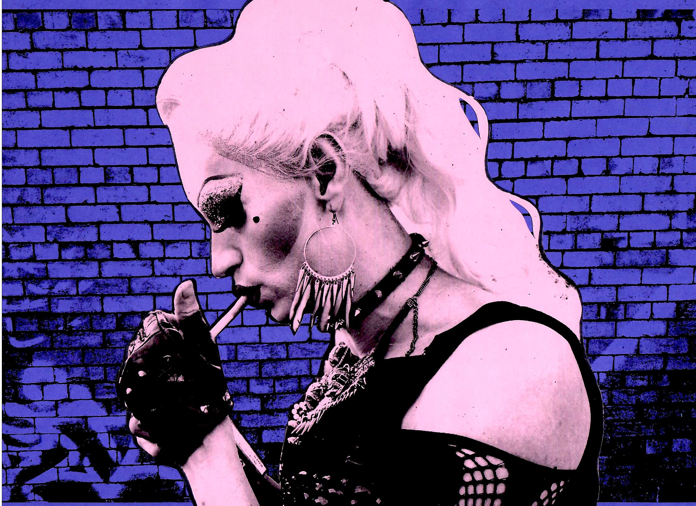 lady smoking a cigarette filtered in pink against a blue brick wall