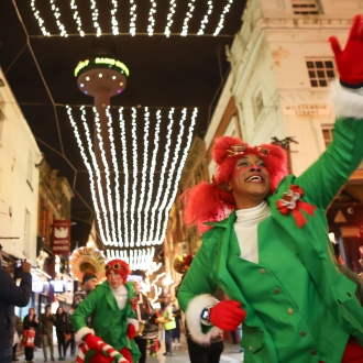 people dressed as elves performing in liverpool city centre