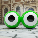 two large green eyes on the paving stones of the bluecoat, with the bluecoat in the background - image called OK Cherub