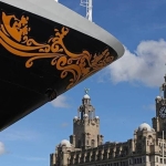 disney cruise ship in front of royal liver building