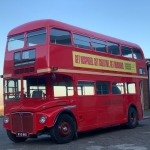 red london transport bus with liverpool writes banner on the side