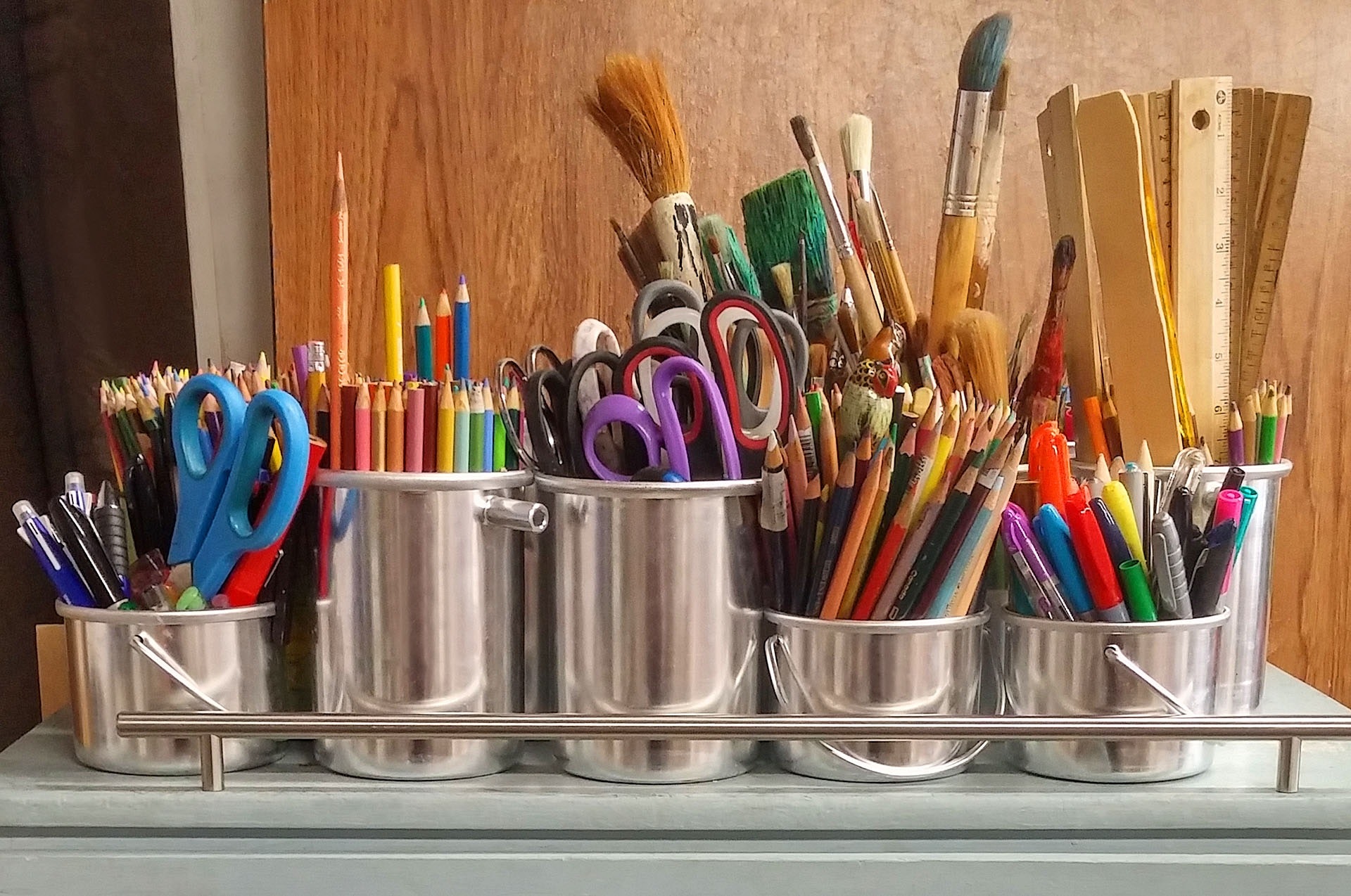 crafting - pots with paintbrushes, pens, pencils