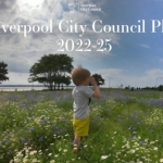 a little boy in a park meadow on a summer day text in white says liverpool city council plan 2022-25 detailing services