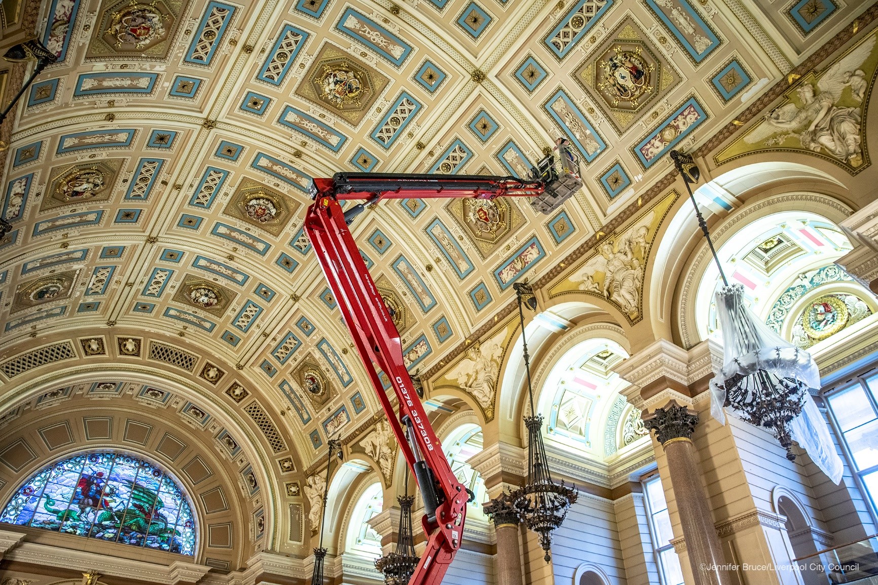 work being undertaken up a crane on the ceiling of st georges hall