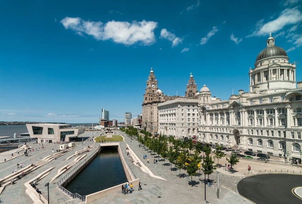liverpool waterfront pier head viewed from the museum of liverpool with a blue sky