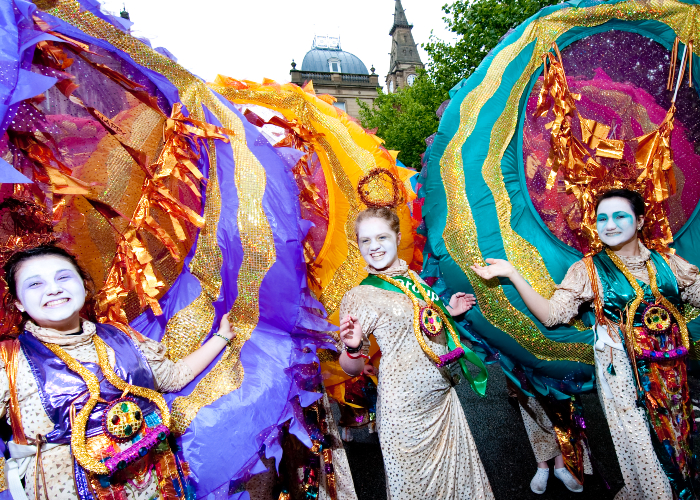 colourful parade of people celebrating the Mayor of Liverpool