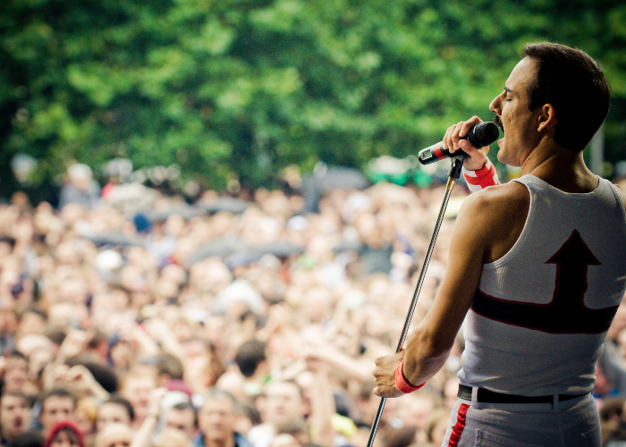 Freddie Mercury tribute band playing in front of crowds at Mathew Street Festival