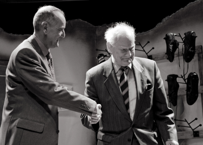 Actor shaking hands with Bill Shankly on stage at the Shankly Show stage production in 2008