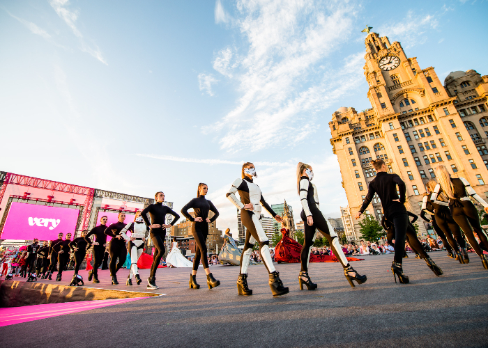 people walking a catwalk on the Pier Head as part of T175 in 2015