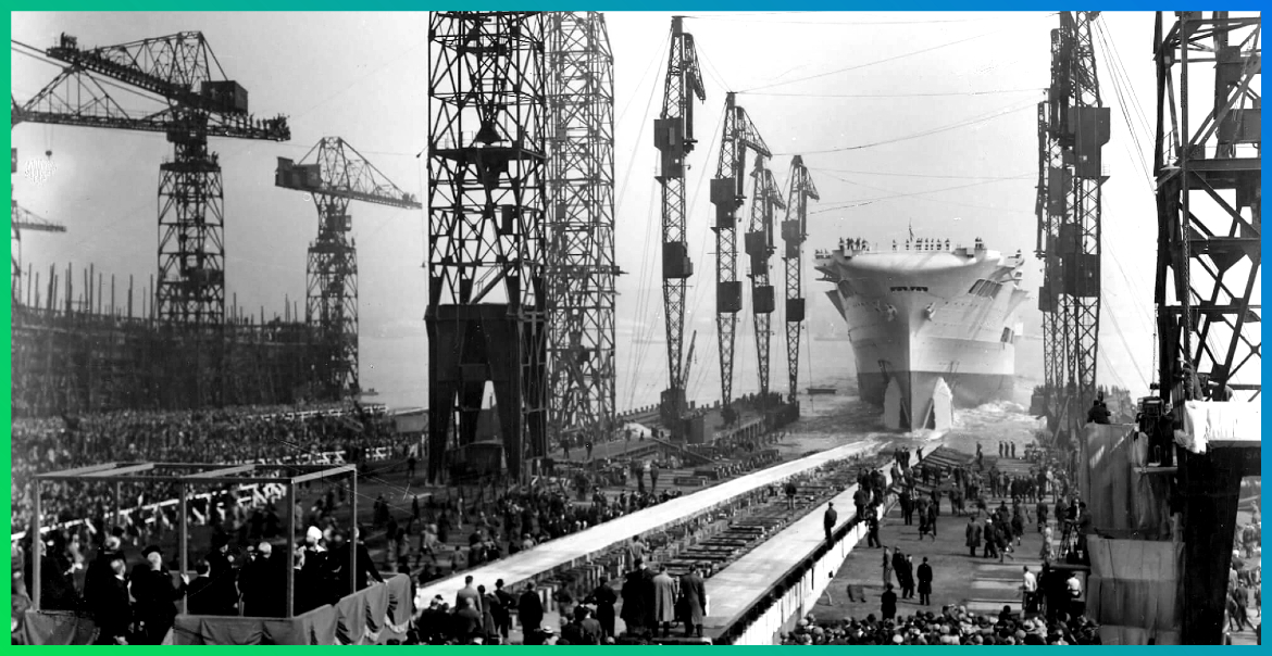 Cammell Lairds in the olden days with people looking on as a new ship is launched into the River Mersey