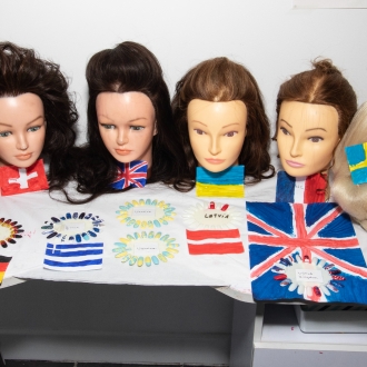 Style head dolls with Eurovision-themed hair styles.
