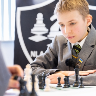 A secondary school pupils playing chess.