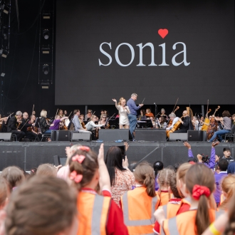Primary school children enjoying Sonia on stage at the Eurovision Village.