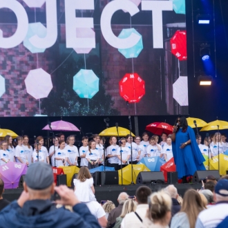 The Neurodiversity Friendly Choir performing on the Eurovision Village stage.