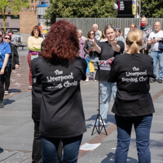 The Liverpool Signing Choir performing in Williamson Square, Liverpool.