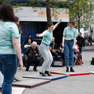A street performance of tap dancers.