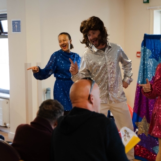 A Eurovision-themed performance taking place in a care home lounge for all of the residents.