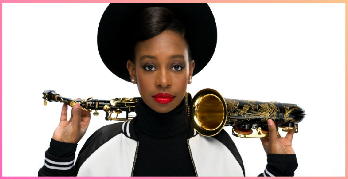 A portrait image of YolanDaBrown holding a saxophone over her shoulders.