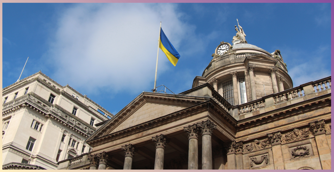 A Ukrainian flag flying from Liverpool Town Hall on a sunny day.