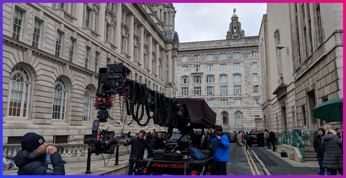 A filming crew working by Liverpool's Three Graces.