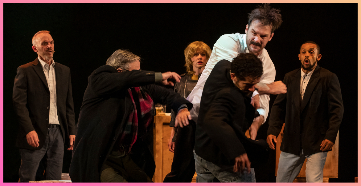 cast from the Boys From The Blackstuff theatre production on stage acting out a fight
