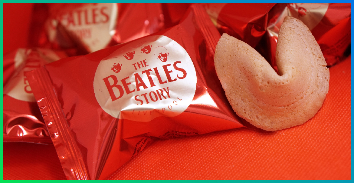 Red fortune cookies with The Beatles Story logo on the wrapping paper.