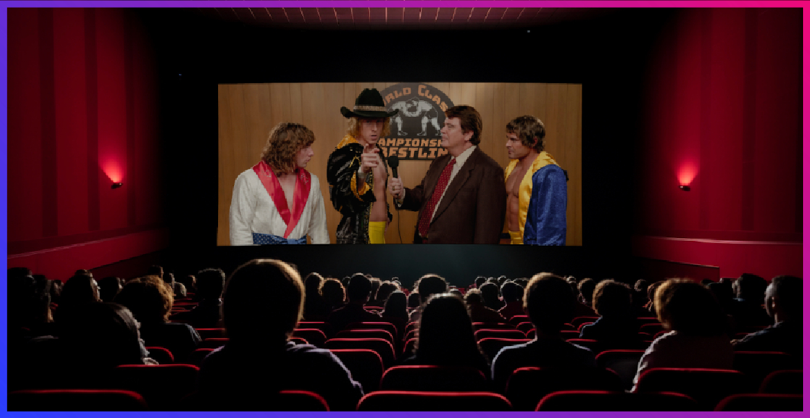 A cinema auditorium with characters on the screen.