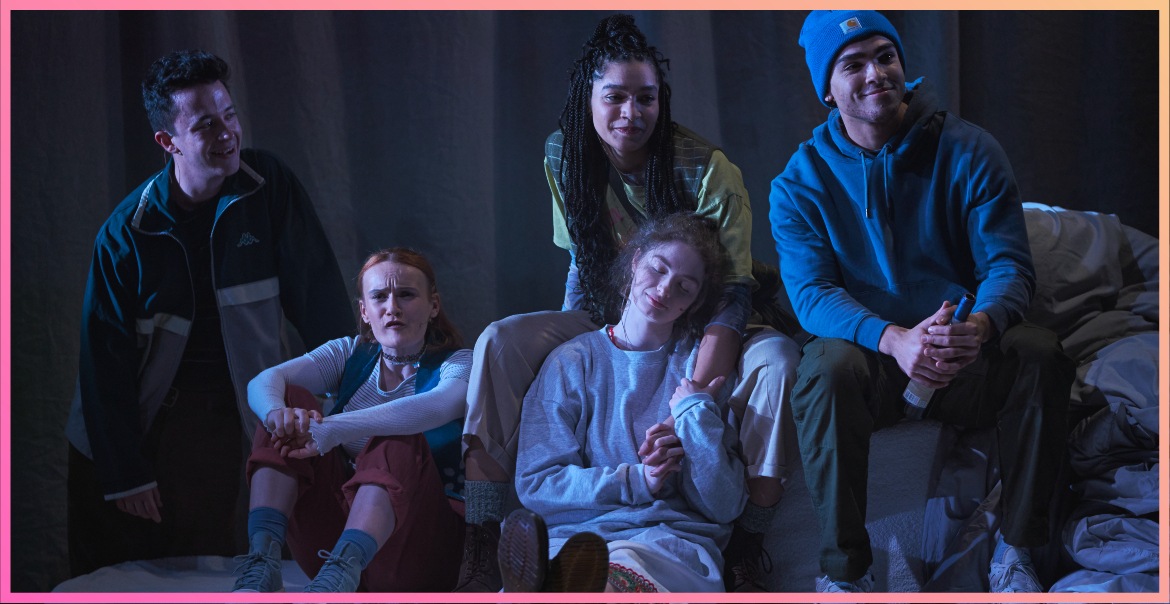 A group of young people sitting around together. A production image of A Song For Ella Grey.