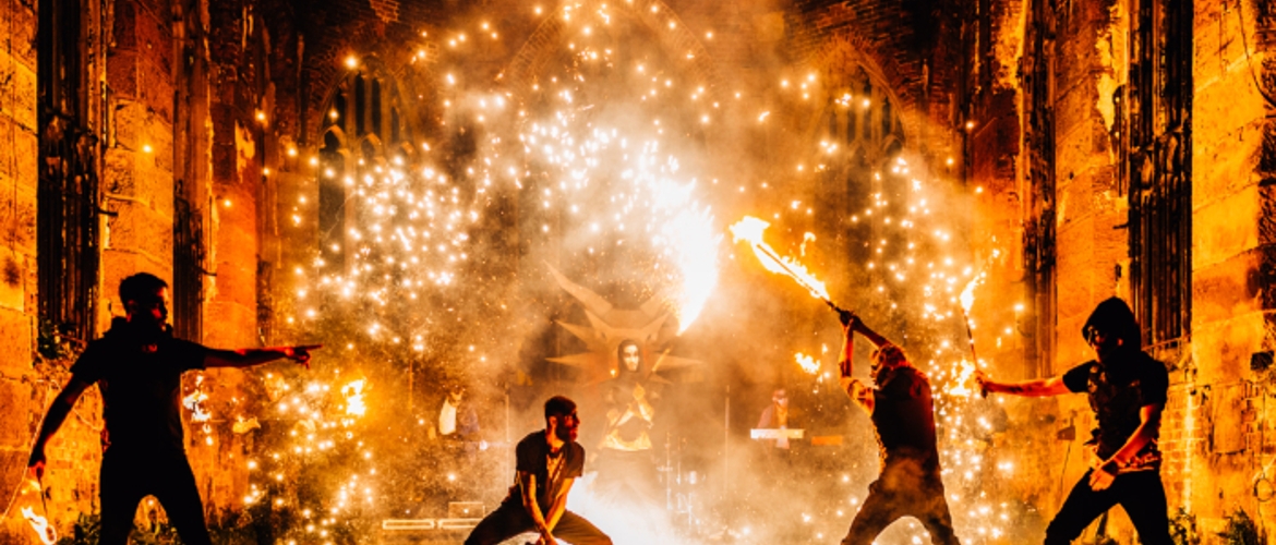 fire theatrics as night at St Luke's Bombed out Church by Bring The Fire Performers