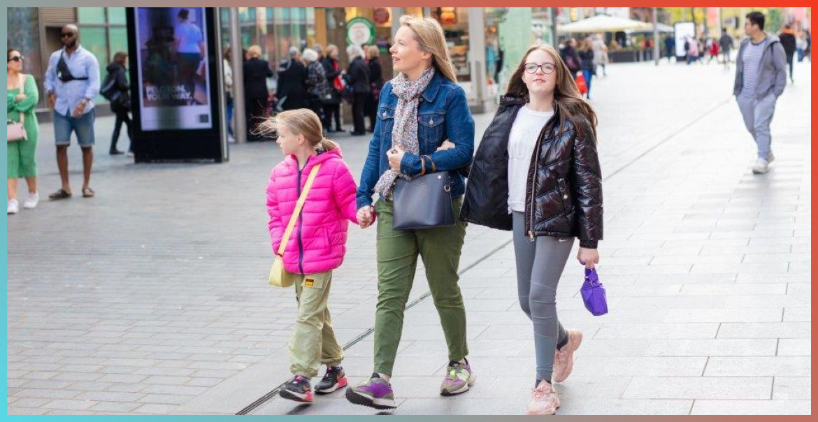 A woman and two young children walking in Liverpool ONE.