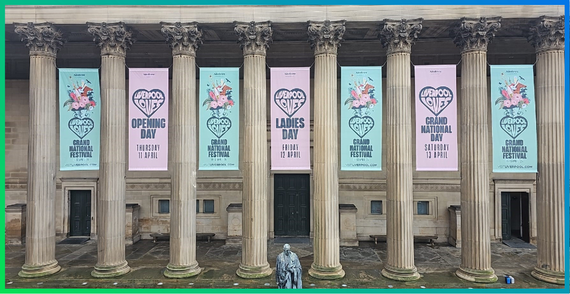 exterior of St George's Hall in Liverpool with Liverpool Loves banners hanging between the colonnades