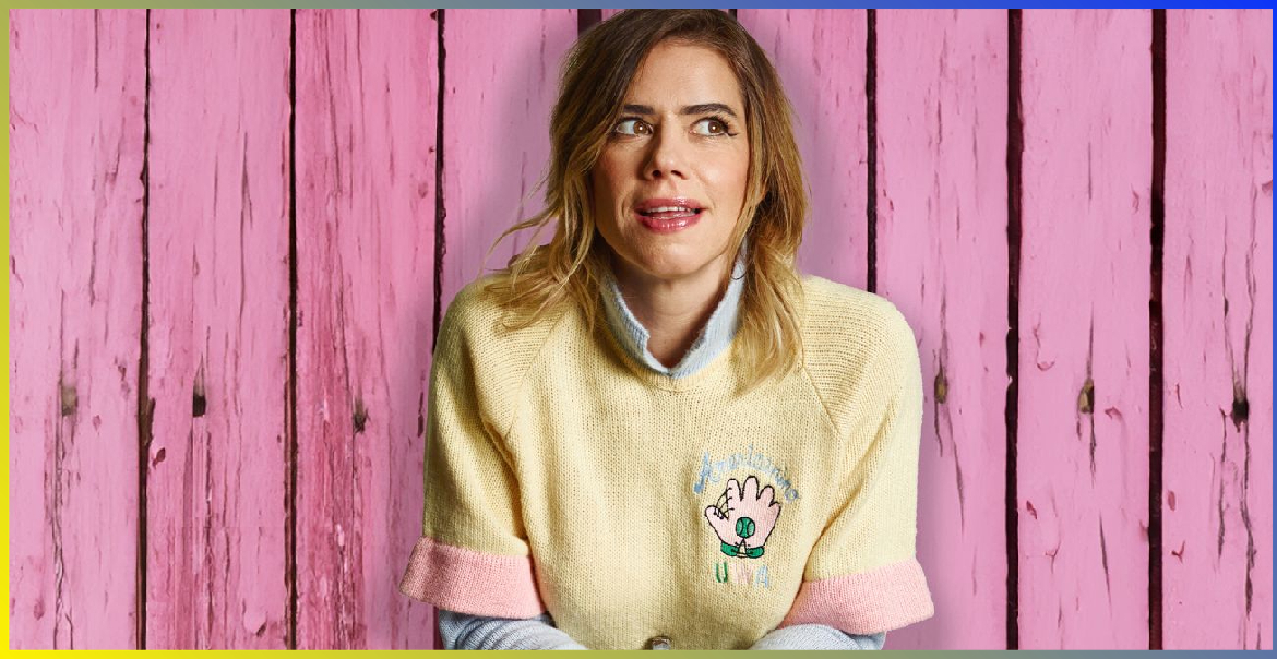 An image of Lou Sanders in front of a background of pink driftwood.