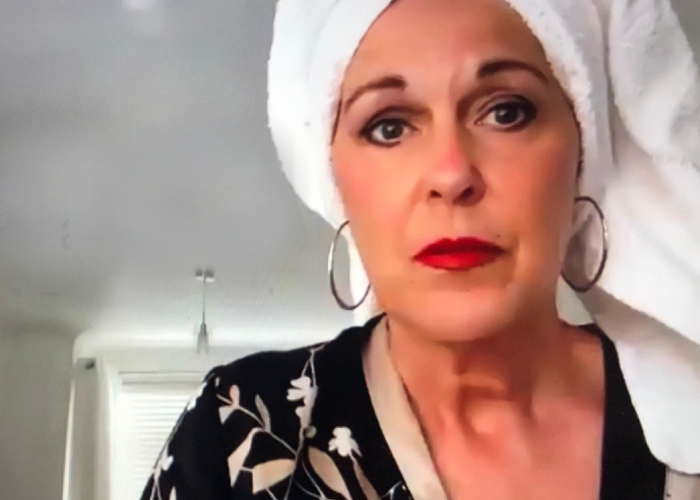 picture of Cath Rice in a dressing gown and hair towel as part of her video Virtual Insanity