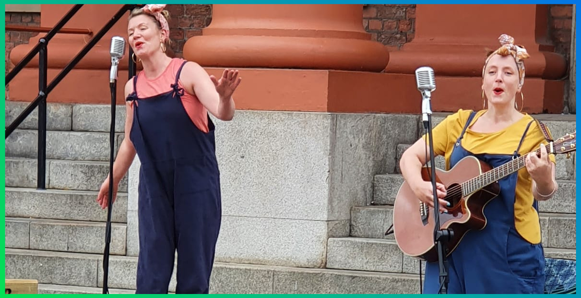 two female singers performing in an outdoor space at Royal Albert Dock Liverpool
