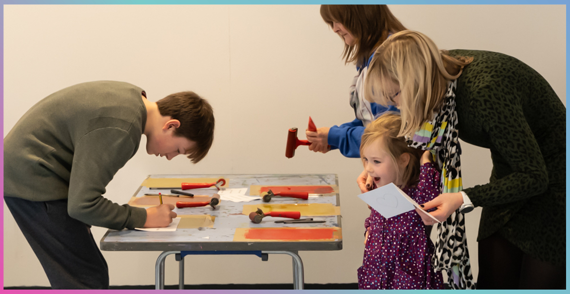 Children taking part in an arts workshop activity.